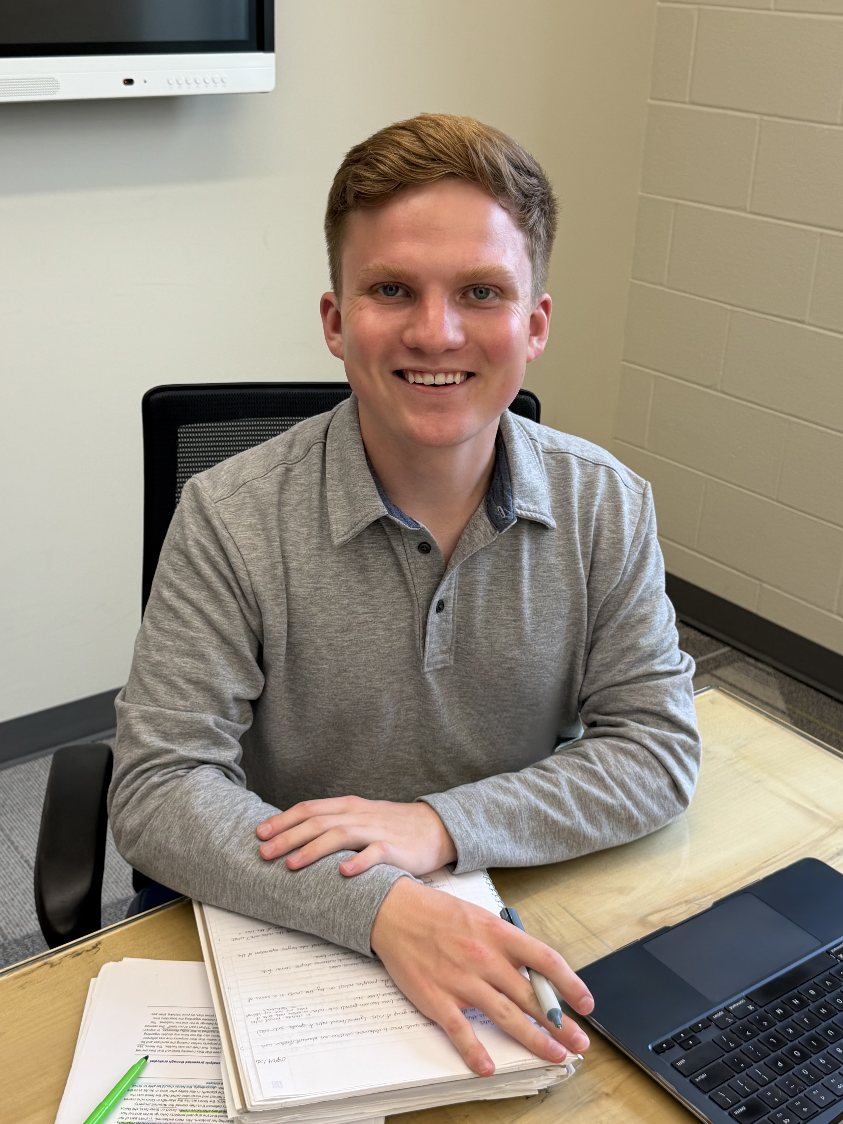 Man smiling at desk